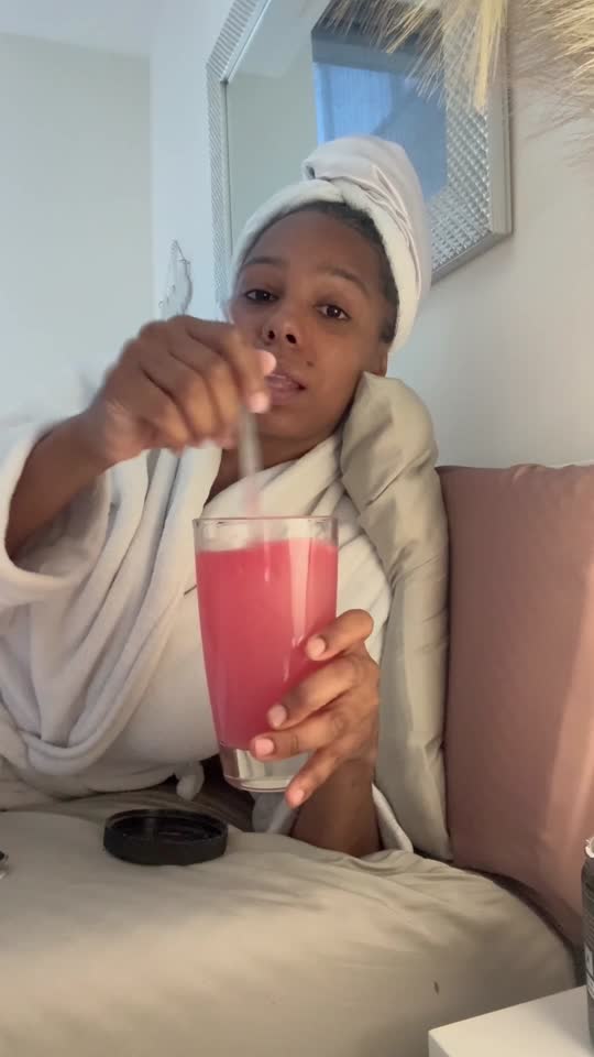 Dana drinking Body Calm in bed