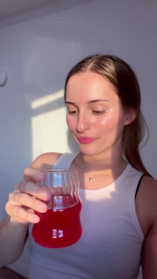 Katie sipping the drink